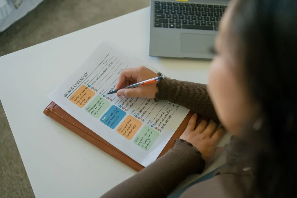 A student organizes a calendar and written notes.