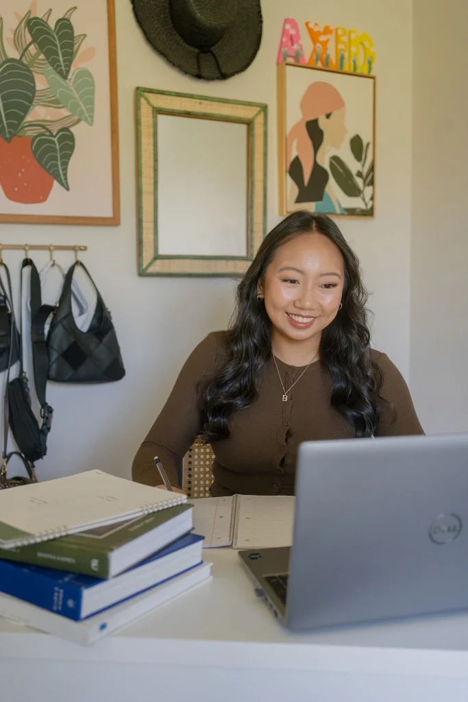 A student works at a laptop at home.